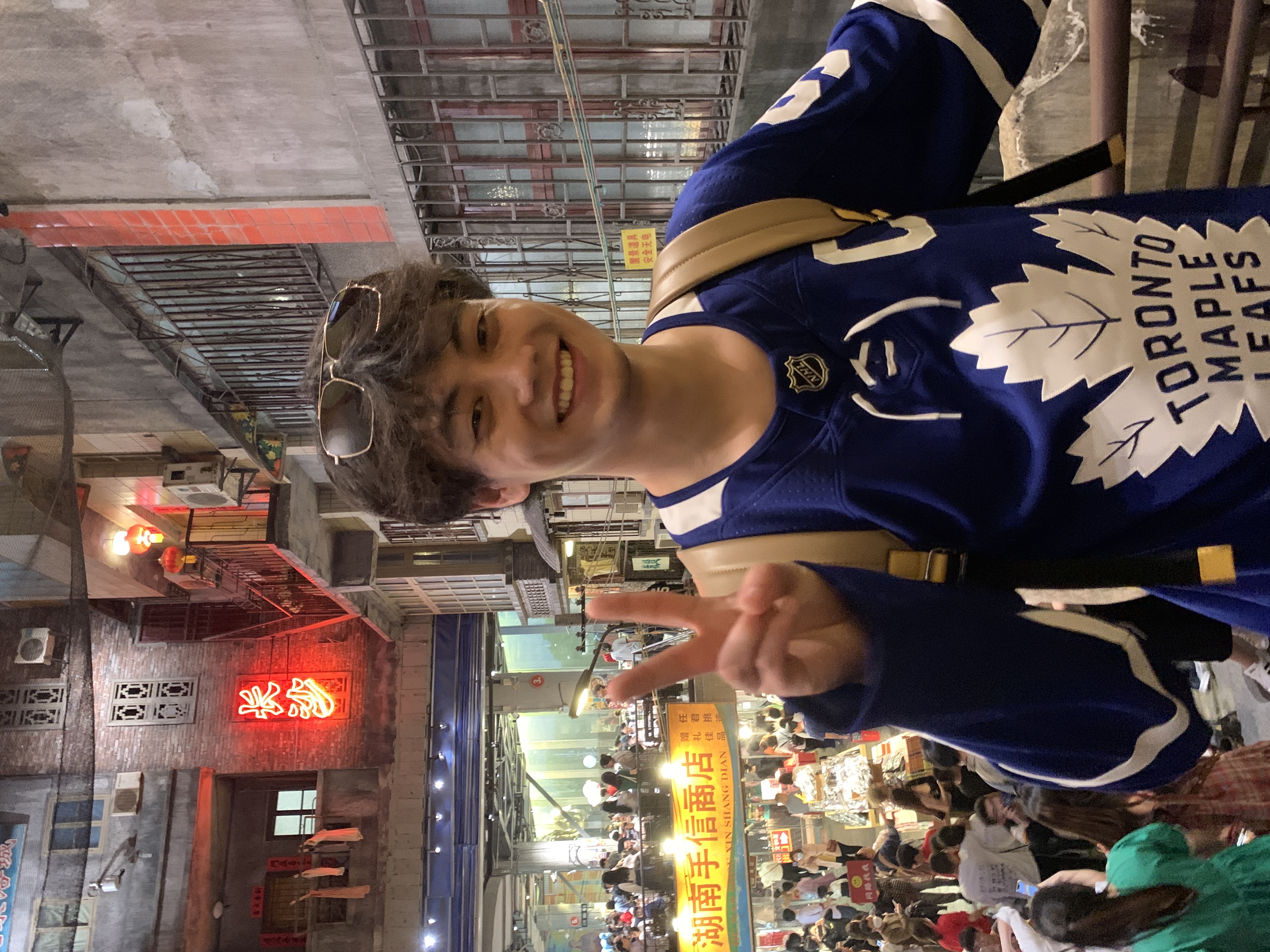 Chongyu Zhu smiling in a Toronto Maple Leafs jersey